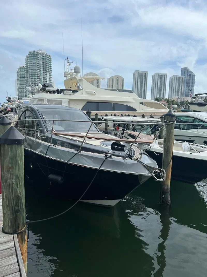Slide: The Image of Luxury yacht Evolve 400HT 2022 docked at marina with city skyline. - 15