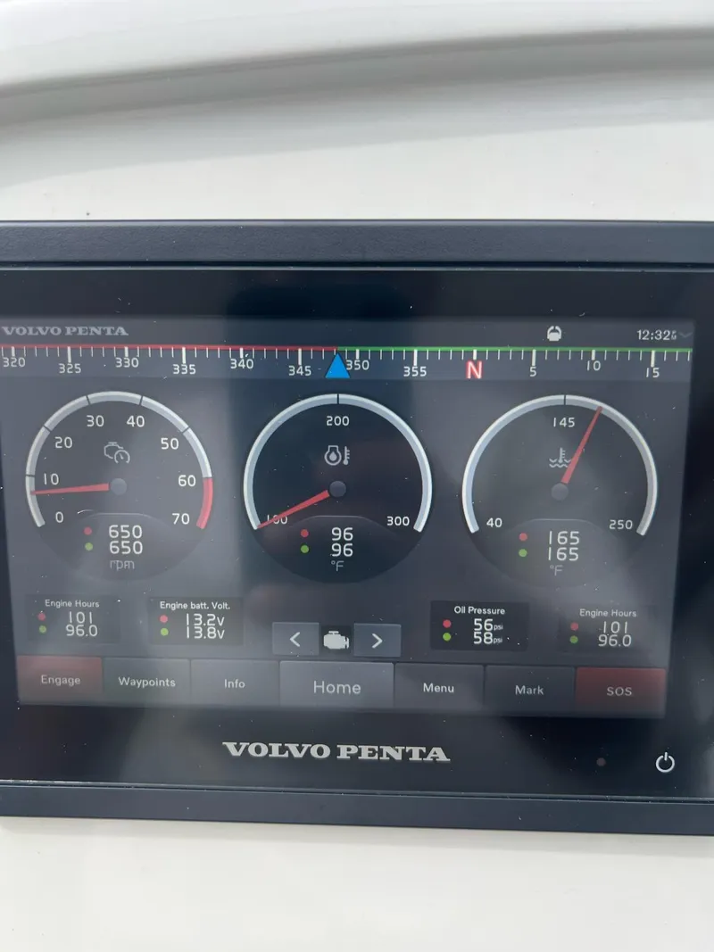 Slide: The Image of Volvo Penta engine display on Evolve 400HT, 2022 model, showing RPM and temperature gauges. - 18