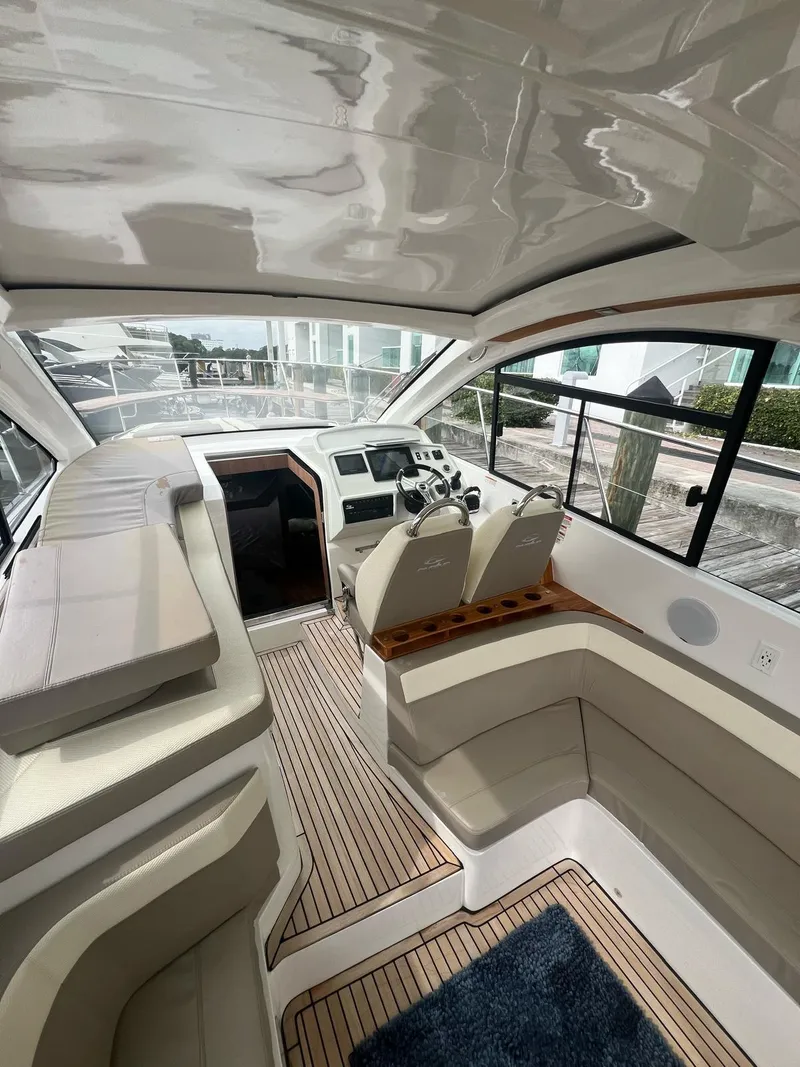 Slide: The Image of Luxurious interior of 2022 Evolve 400HT yacht with plush seating and modern dashboard. - 6
