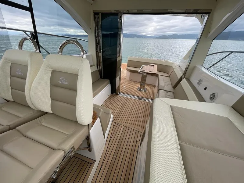 Slide: The Image of Luxurious interior of 2022 Evolve 400HT yacht with beige seating and wooden flooring. - 8