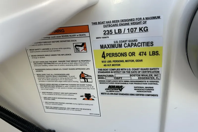 Slide: The Image of Capacity and safety label on a 2025 Boston Whaler 130 Super Sport boat. - 21