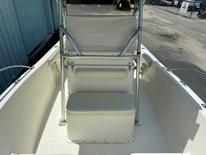 Slide: The Image of 1997 Pursuit 2470 Center Console boat interior with seating and storage. - 10
