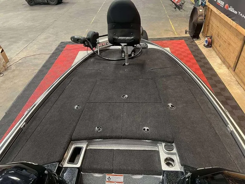 Slide: The Image of 2014 Nitro Z Series Z-9 boat interior with black carpet and seating. - 7