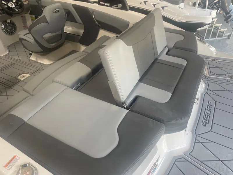 Slide: The Image of 2026 Chaparral GT Surf 1 boat interior with gray seating and modern design. - 4