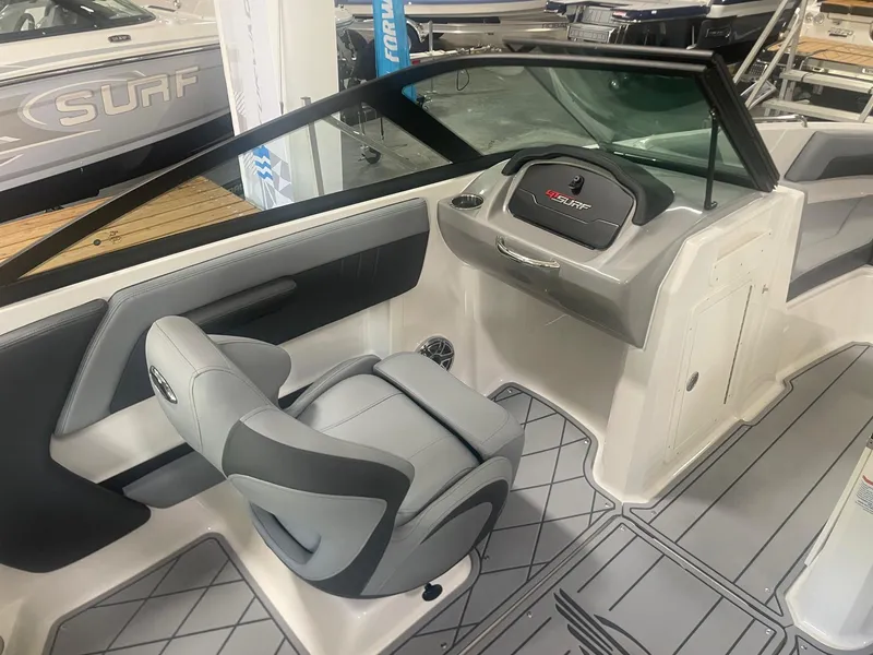 Slide: The Image of Interior of 2026 Chaparral GT Surf 1 boat, featuring sleek seating and modern dashboard. - 8