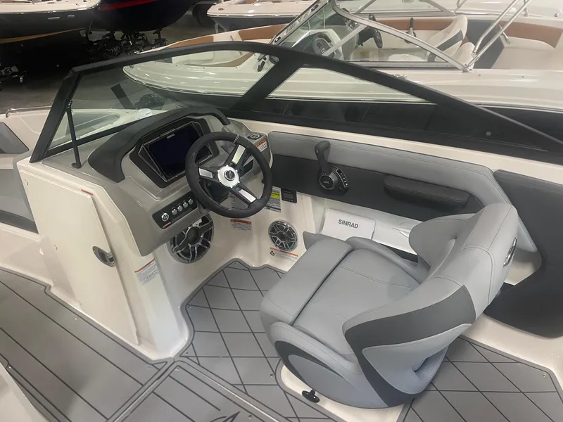 Slide: The Image of Interior of 2026 Chaparral GT Surf 1 boat, featuring modern helm and seating. - 9