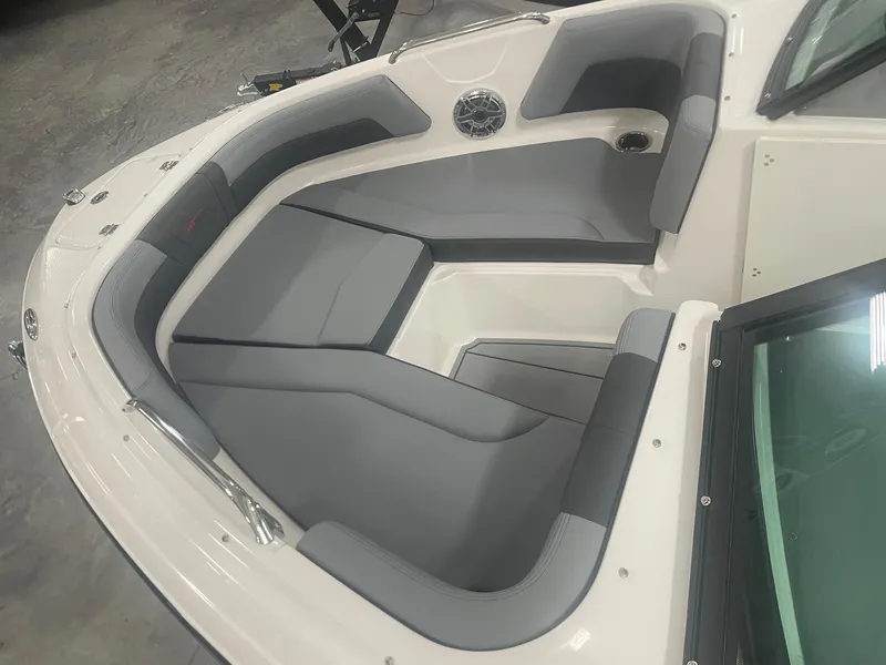 Slide: The Image of 2026 Chaparral GT Surf 1 boat interior with gray seating and sleek design. - 6