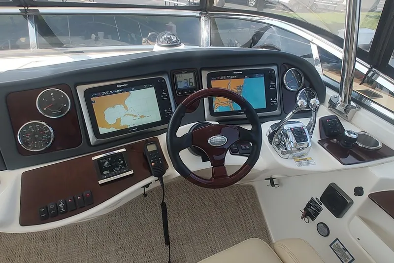 Slide: The Image of Cockpit of 2015 Meridian 441 Sedan with navigation screens and controls. - 17