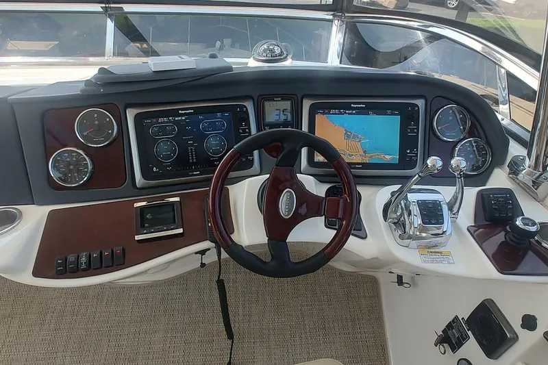 Slide: The Image of Dashboard of a 2015 Meridian 441 Sedan yacht with navigation controls and displays. - 18