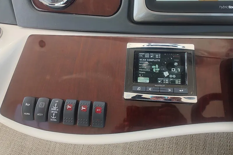 Slide: The Image of Control panel of a 2015 Meridian 441 Sedan yacht with digital display and switches. - 19