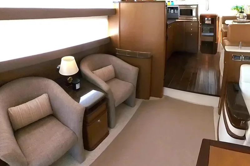 Slide: The Image of Luxurious interior of a 2015 Meridian 441 Sedan yacht with cozy seating and modern kitchen. - 26