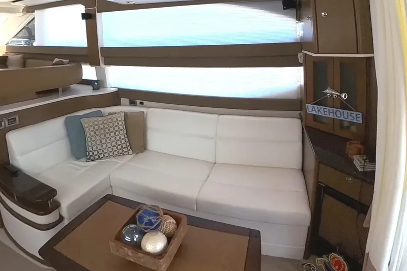 Slide: The Image of Luxurious interior of 2015 Meridian 441 Sedan with white seating and decorative pillows. - 28