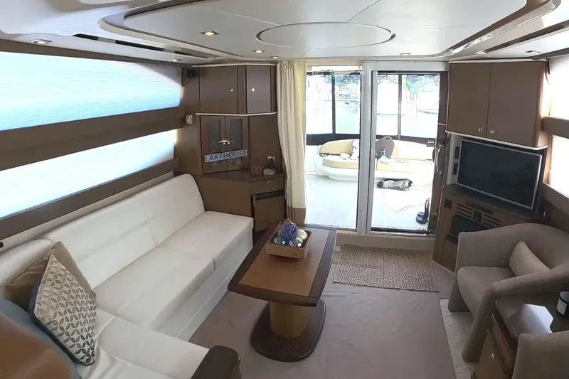 Slide: The Image of Luxurious interior of a 2015 Meridian 441 Sedan yacht with modern furnishings and large windows. - 31