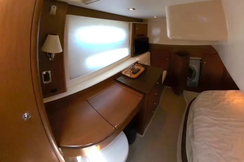 Slide: The Image of Luxurious interior of a 2015 Meridian 441 Sedan yacht, featuring wood finishes and modern amenities. - 34