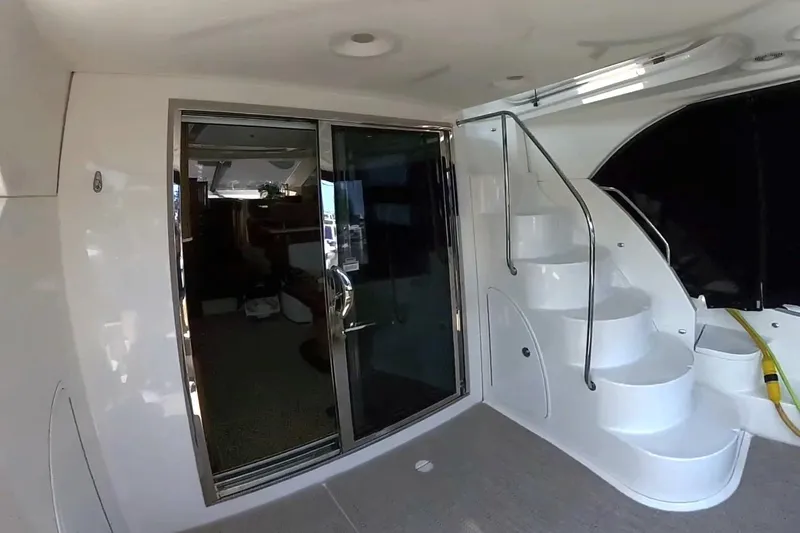 Slide: The Image of 2015 Meridian 441 Sedan yacht interior with stairs and sliding glass door. - 6