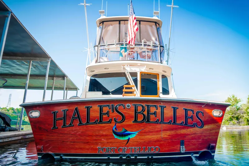 Slide: The Image of 1997 Ocean Yachts 60 Sport Fish boat named "Hale's Belles" at dock, Port of Tellico. - 11