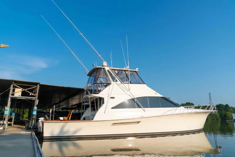 Slide: The Image of 1997 Ocean Yachts 60 Sport Fish boat docked under clear blue sky. - 17