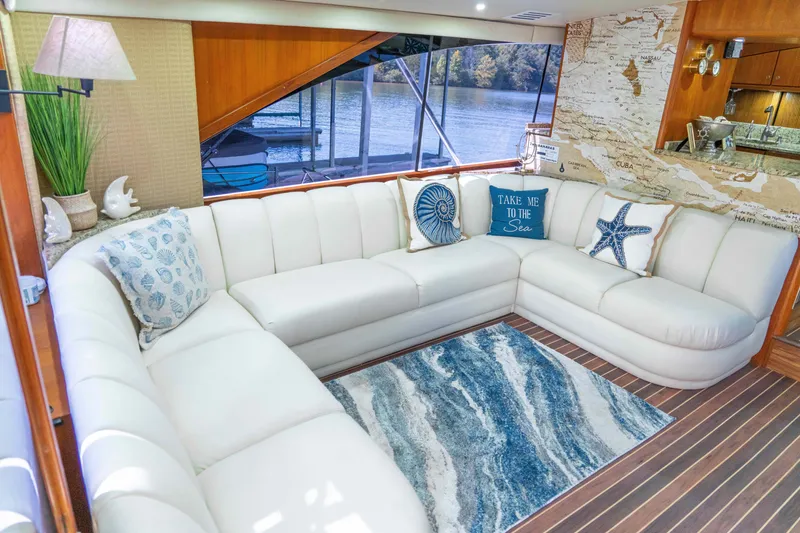 Slide: The Image of Luxurious 1997 Ocean Yachts 60 Sport Fish interior with elegant white seating and nautical decor. - 21