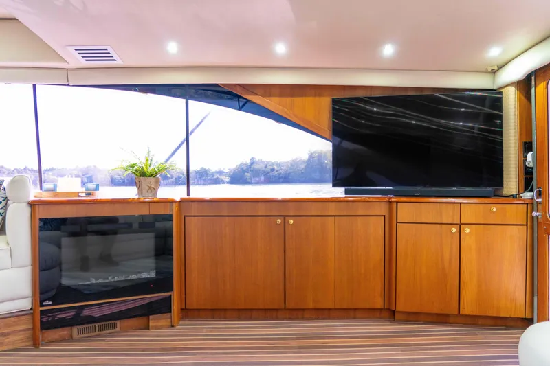 Slide: The Image of Luxurious interior of 1997 Ocean Yachts 60 Sport Fish with wood cabinetry and large windows. - 26