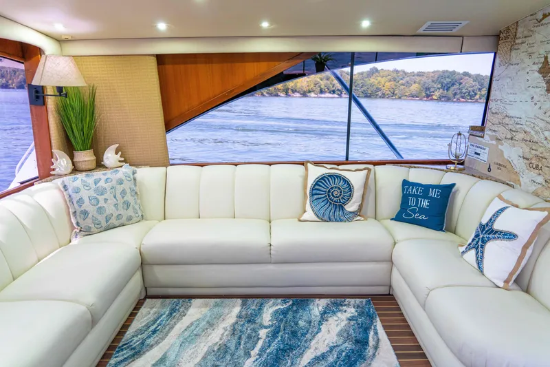 Slide: The Image of Luxurious interior of 1997 Ocean Yachts 60 Sport Fish with elegant white seating and nautical decor. - 30