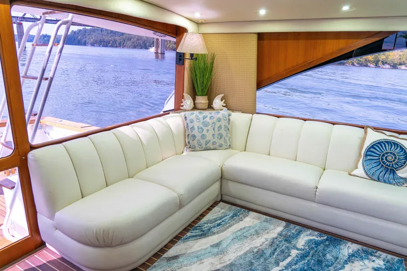 Slide: The Image of Luxurious interior of 1997 Ocean Yachts 60 Sport Fish with white seating and scenic water view. - 31