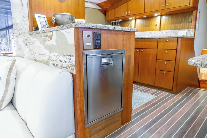 Slide: The Image of Interior of 1997 Ocean Yachts 60 Sport Fish with modern kitchen and wood cabinetry. - 36