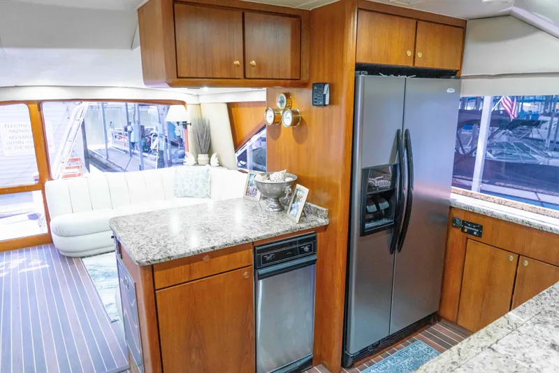 Slide: The Image of Luxurious 1997 Ocean Yachts 60 Sport Fish interior with modern kitchen and seating area. - 38