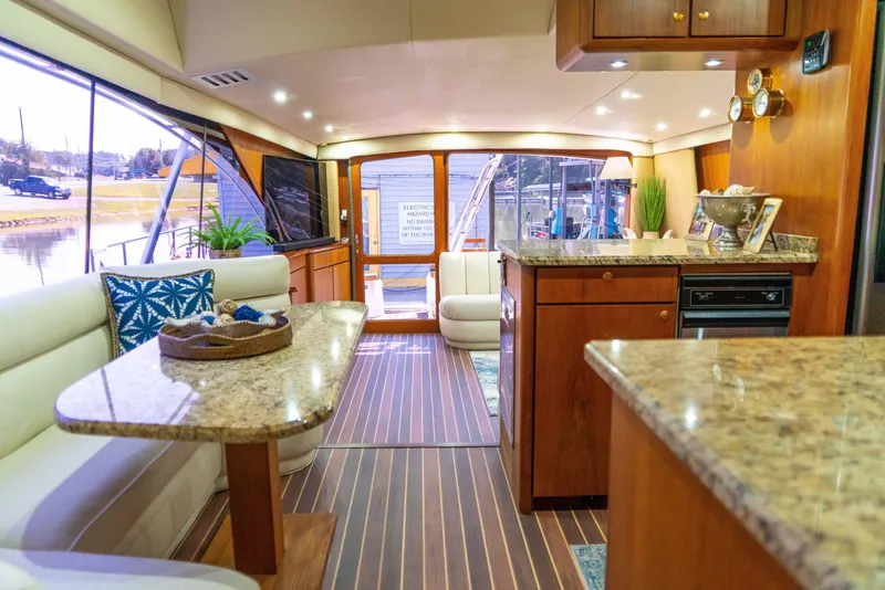 Slide: The Image of Luxurious interior of a 1997 Ocean Yachts 60 Sport Fish with elegant wood finishes. - 39