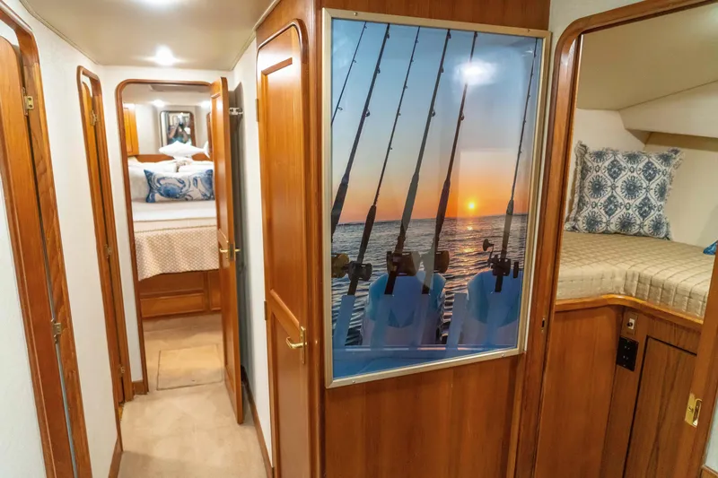 Slide: The Image of Interior of 1997 Ocean Yachts 60 Sport Fish with wooden finishes and nautical decor. - 43