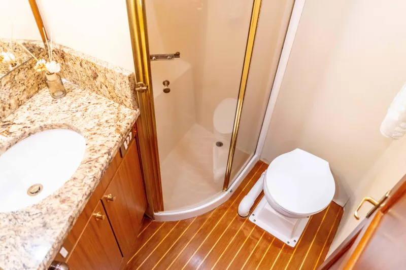 Slide: The Image of Bathroom interior of 1997 Ocean Yachts 60 Sport Fish with shower and granite countertop. - 48