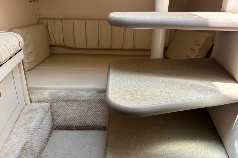 Slide: The Image of Interior cabin of 2001 Searay 29 Amber boat with steps and seating area. - 38