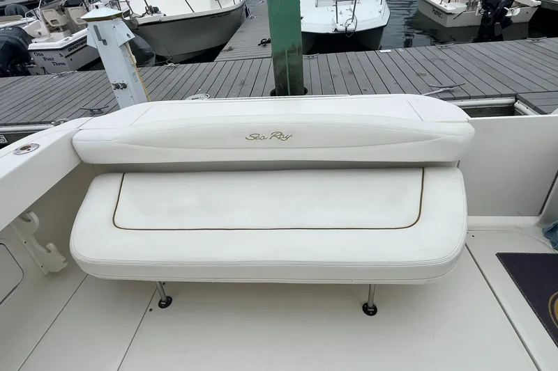 Slide: The Image of White seating on 2001 Sea Ray 290 Amberjack boat at dock. - 9