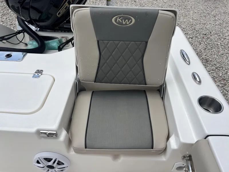 Slide: The Image of 2026 Key West 230 Bay Reef boat seat with cup holders and speaker. - 12