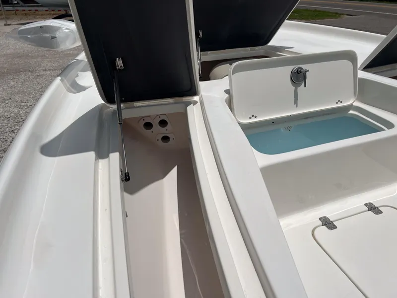 Slide: The Image of Open storage compartments on a 2026 Key West 230 Bay Reef boat. - 19