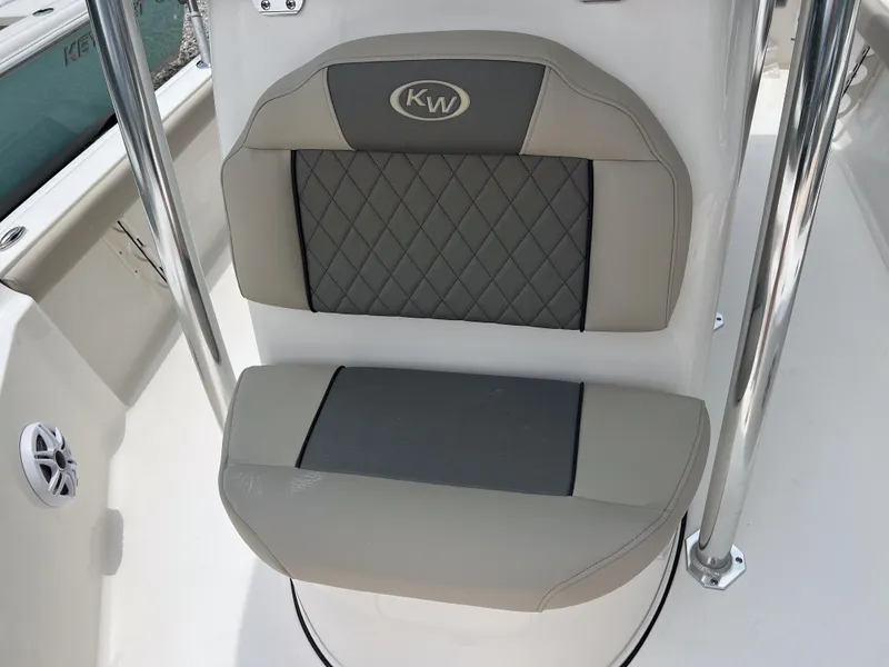 Slide: The Image of 2026 Key West 230 Bay Reef boat seat with quilted design and KW logo. - 20