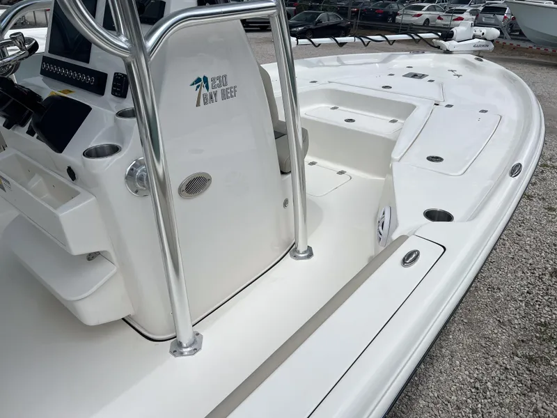 Slide: The Image of 2026 Key West 230 Bay Reef boat interior with console and seating area. - 3