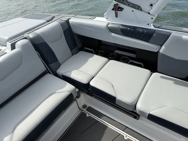 Slide: The Image of 2023 Malibu M220 interior with luxurious seating. - 16