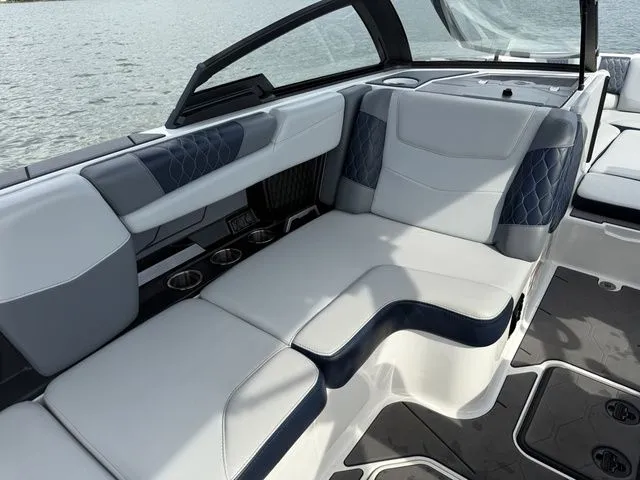 Slide: The Image of Interior of 2023 Malibu M220 boat with luxurious seating. - 19