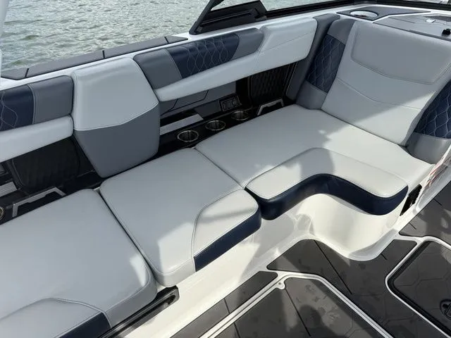 Slide: The Image of Interior of 2023 Malibu M220 boat with luxurious seating. - 20