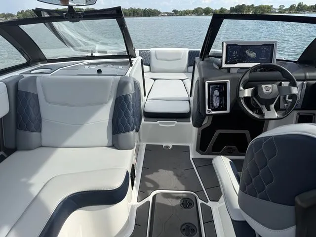 Slide: The Image of Interior of a 2023 Malibu M220 boat with luxurious features. - 21