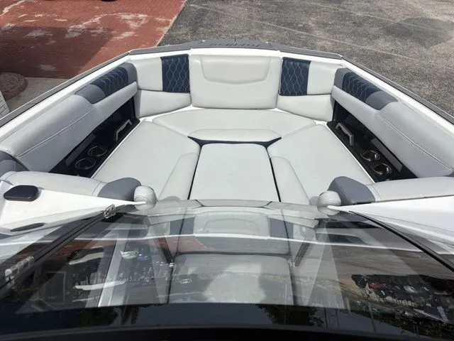 Slide: The Image of 2023 Malibu M220 boat interior with luxurious seating. - 33