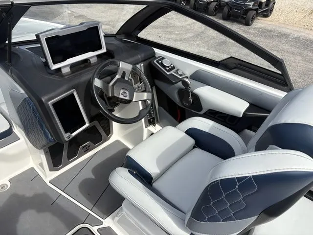Slide: The Image of Interior of 2023 Malibu M220 with modern helm station. - 34