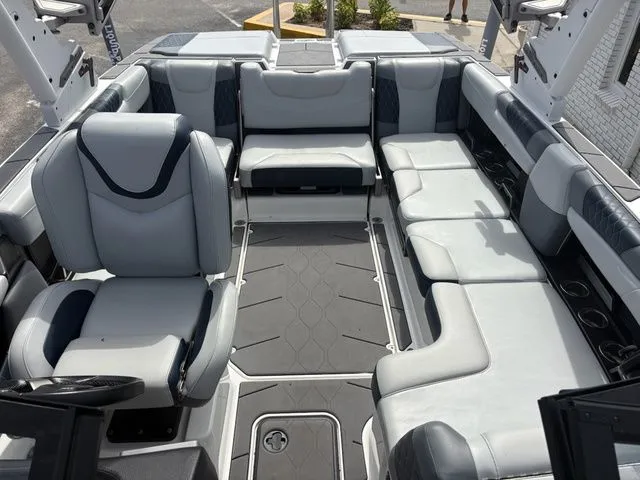 Slide: The Image of Interior of 2023 Malibu M220 boat with luxurious seating. - 35