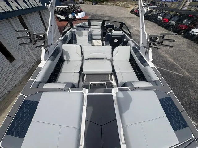Slide: The Image of Interior view of 2023 Malibu M220 boat with gray seating. - 38