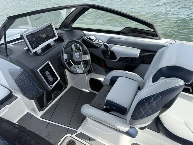 Slide: The Image of Interior of 2023 Malibu M220 with modern helm station. - 44