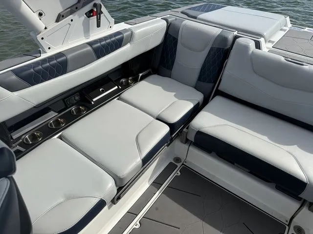 Slide: The Image of 2023 Malibu M220 boat interior with luxurious seating. - 46