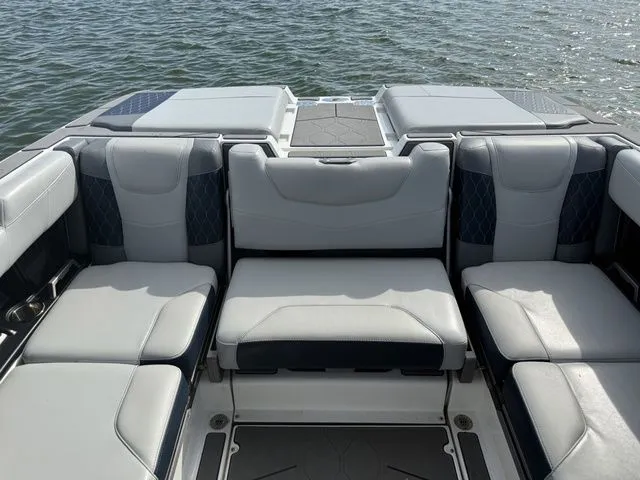 Slide: The Image of Interior of 2023 Malibu M220 boat with luxurious seating. - 47