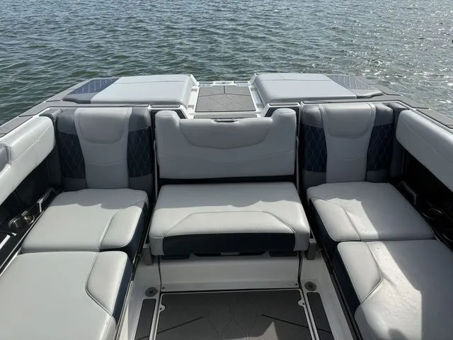 Slide: The Image of Interior of 2023 Malibu M220 boat with luxurious seating. - 48