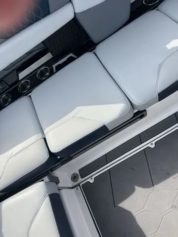 Slide: The Image of Interior of 2023 Malibu M220 with white seating. - 49