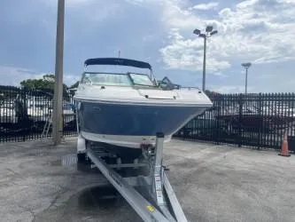 Slide: The Image of 2022 Sea Ray SDX 250 boat on trailer in outdoor lot. - 4